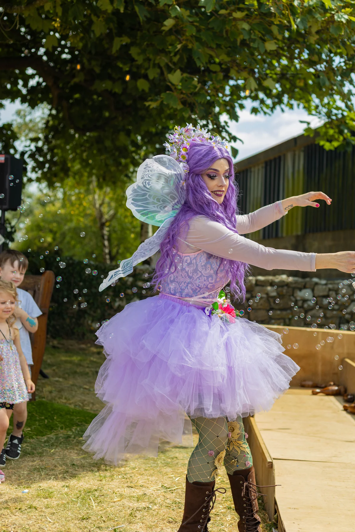 A fairy performer entertaining children at JOPOFEST