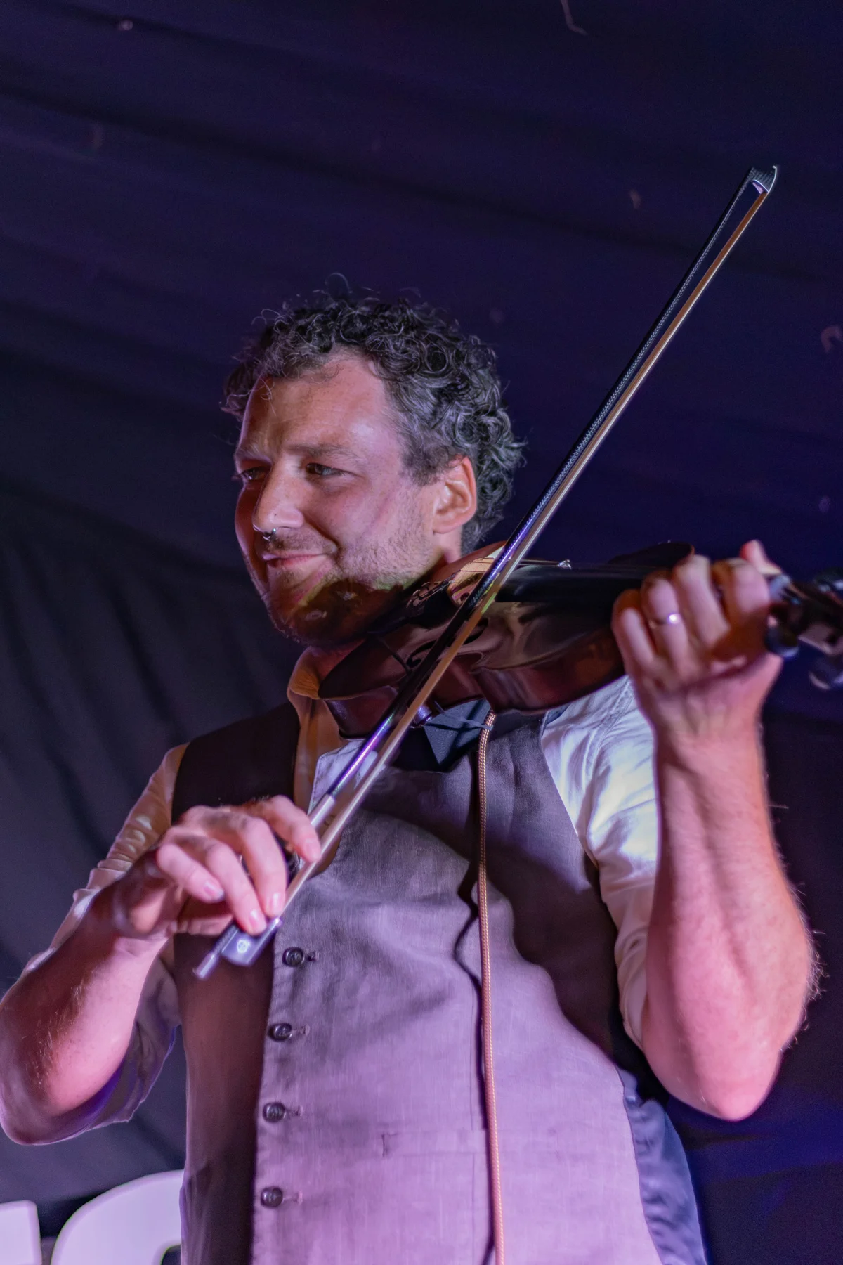 A violin player performing on the JOPOFEST stage