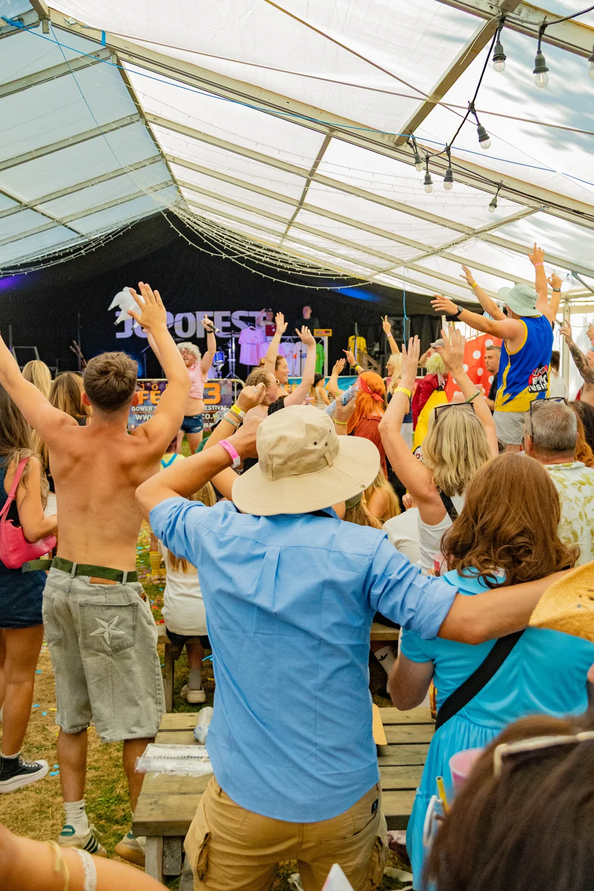 JOPOFEST crowd with hands in the air in front of the stage